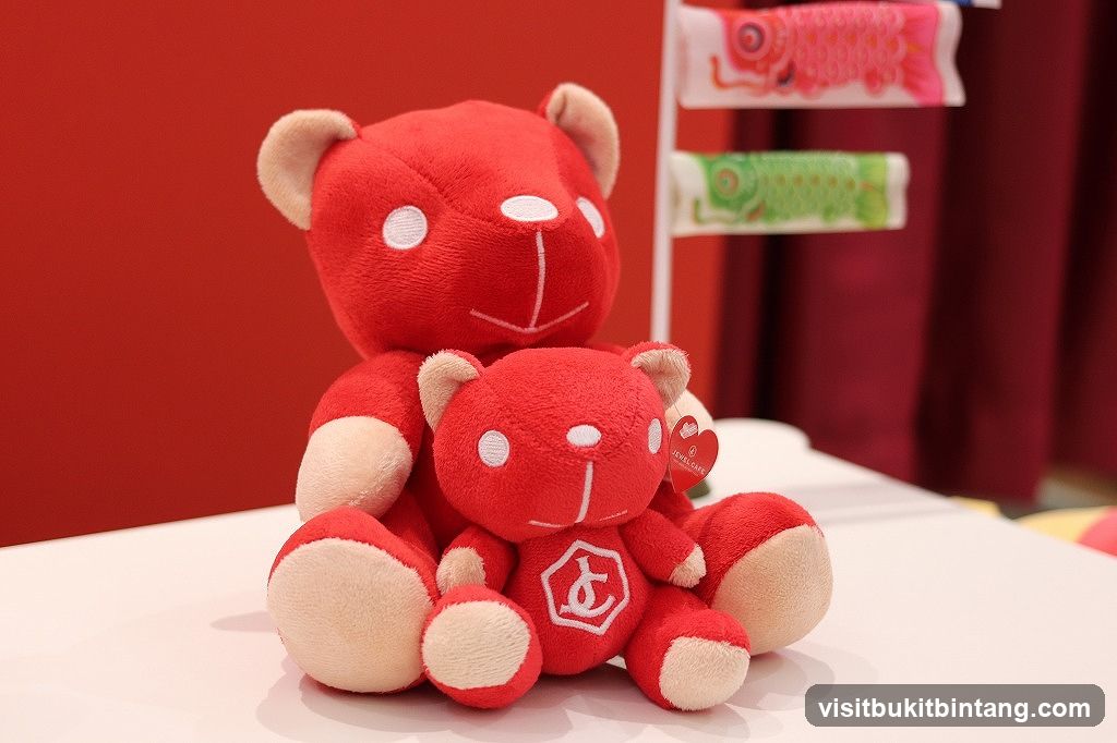 Two red teddy bears