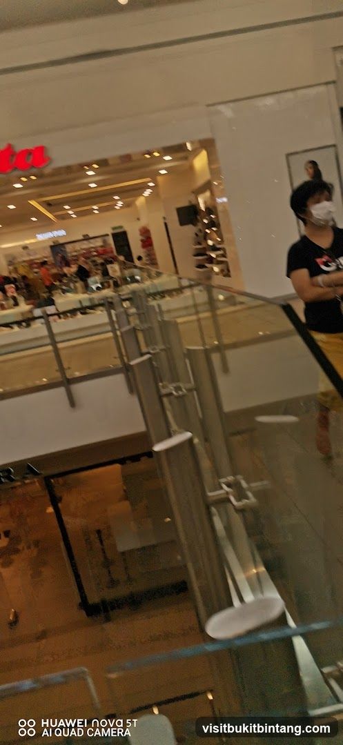 Interior of a shopping mall with a store visible