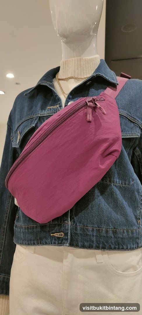 Mannequin wearing denim jacket and fanny pack
