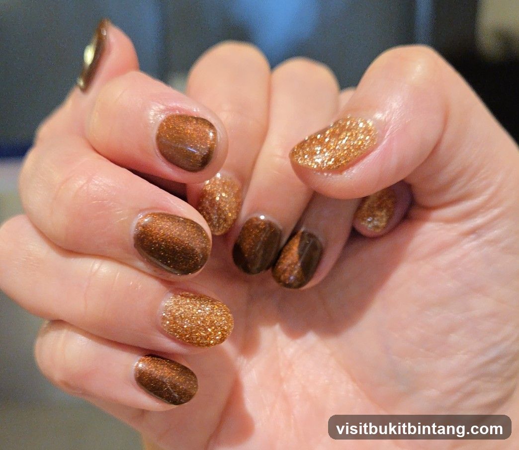 Nails with brown and gold glitter polish
