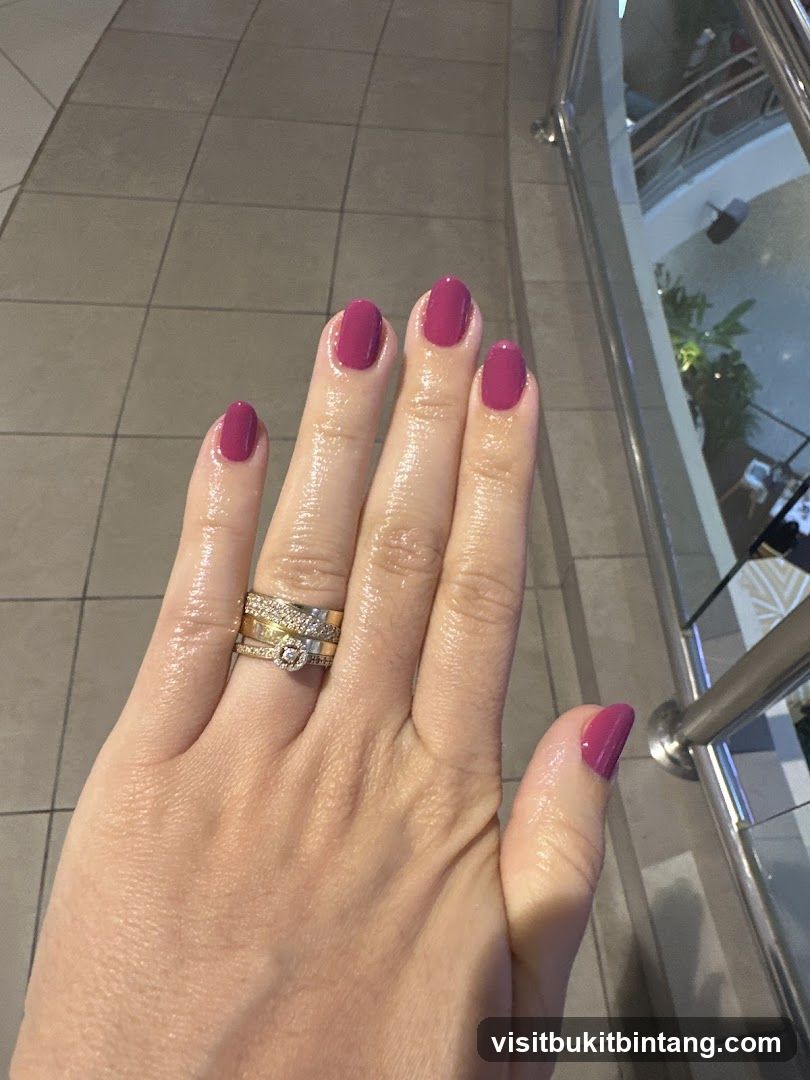 Hand with manicured nails and rings