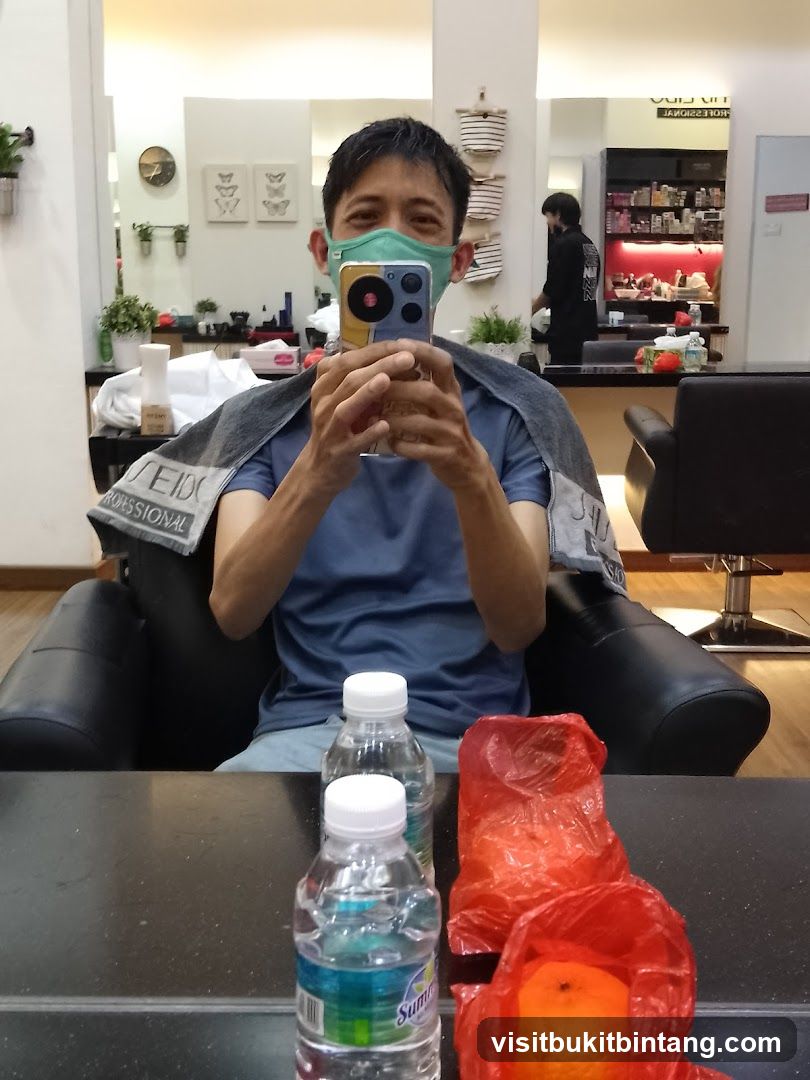 Man taking a selfie in a salon