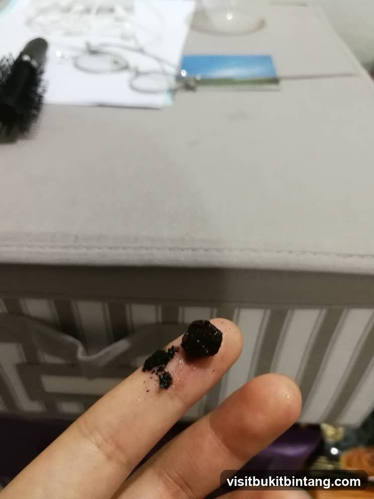 Finger with dark particles