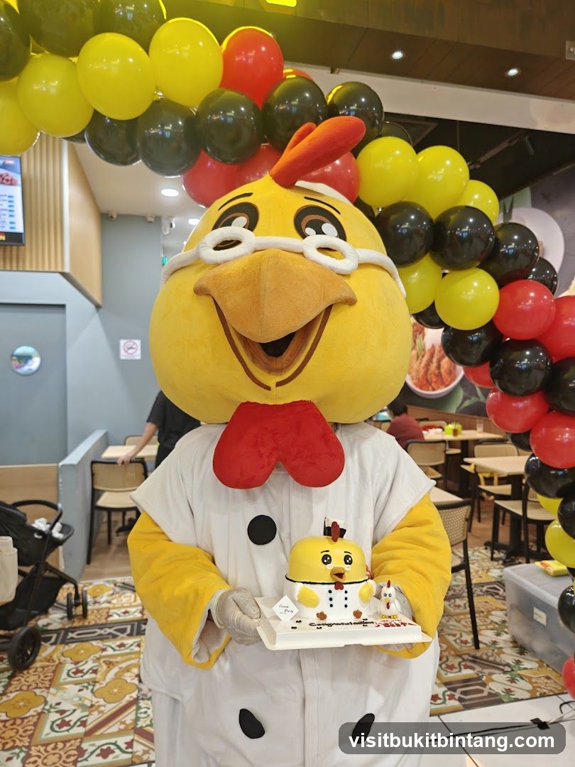 Mascot holding a cake
