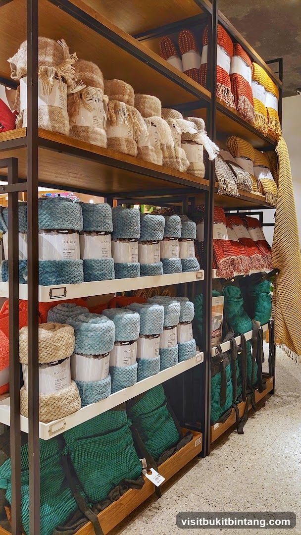Shelves stocked with blankets and throws