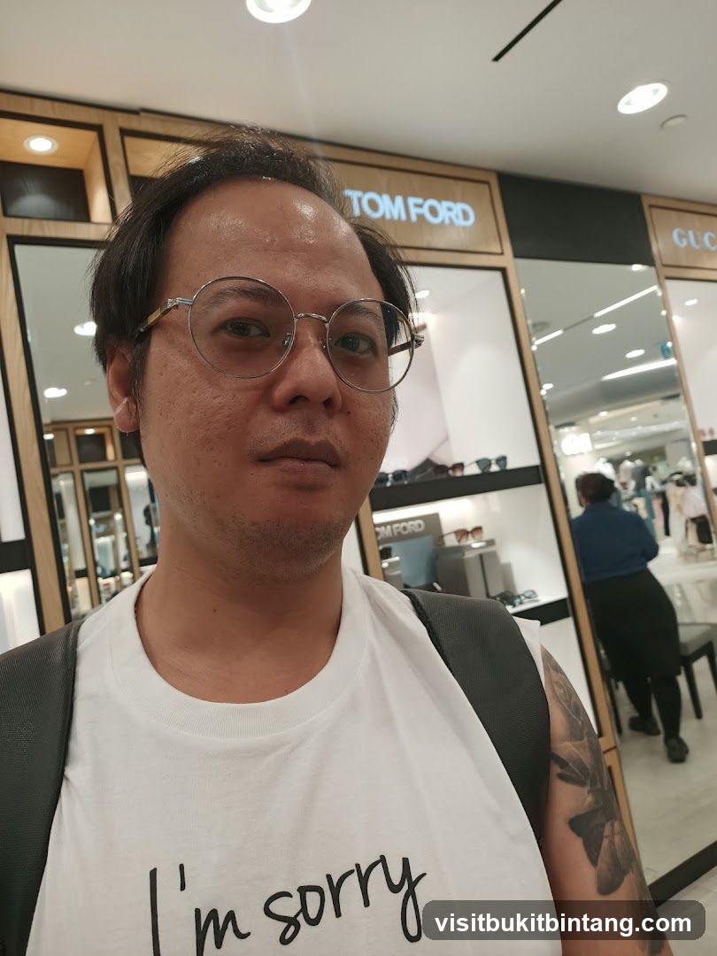 Man in front of Tom Ford and Gucci store