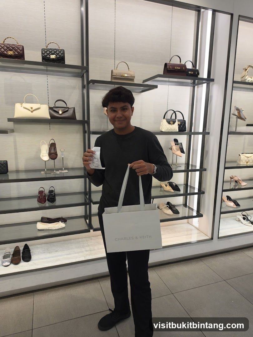 Man holding a shopping bag and receipt in a store