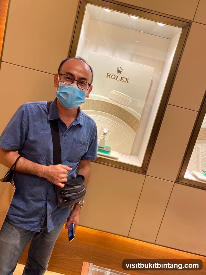 Man in front of Rolex display