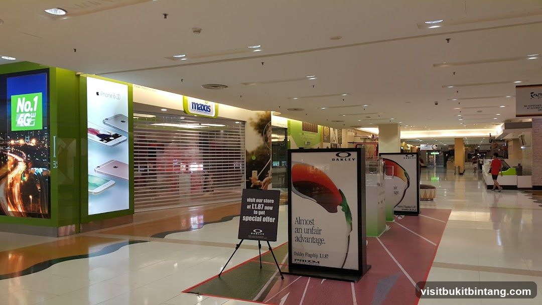 Mall Interior with Storefronts and Advertisements
