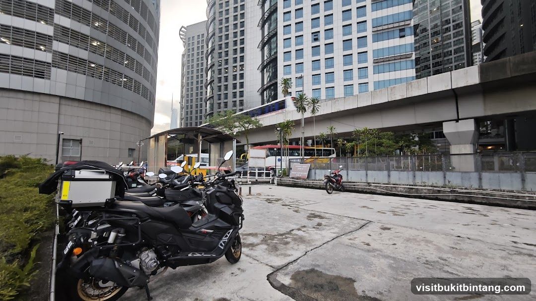 Motorcycles parked near a monorail station