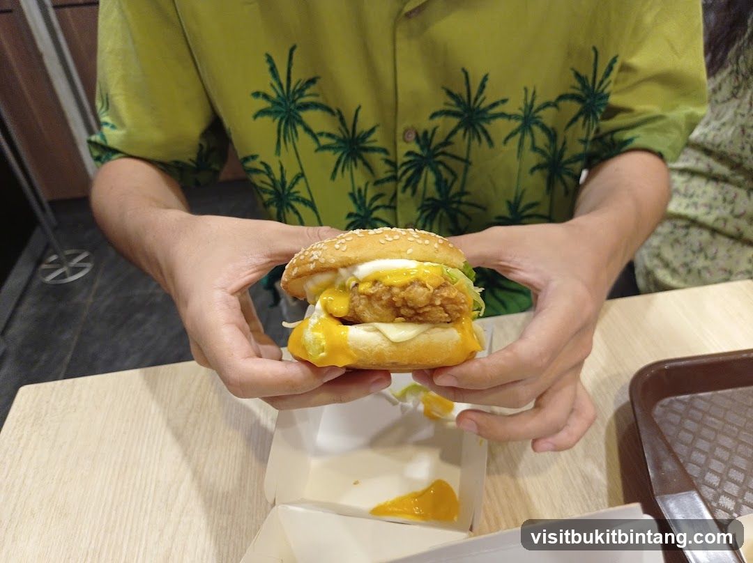 Person holding a burger