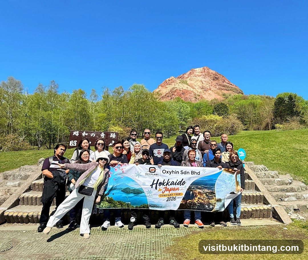 Group photo with banner at scenic location
