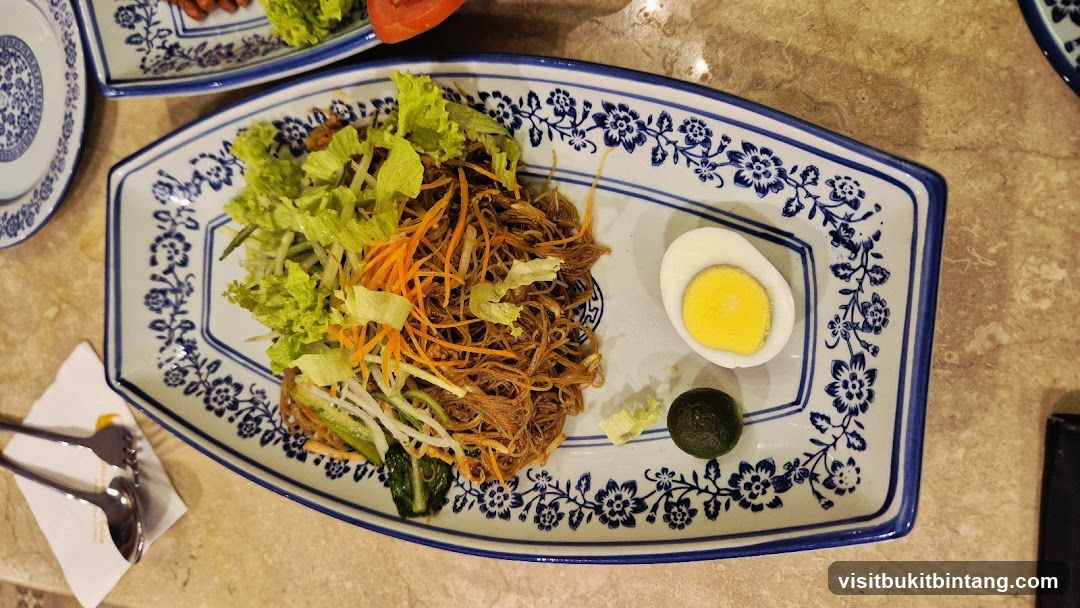 Noodle Dish with Egg and Salad