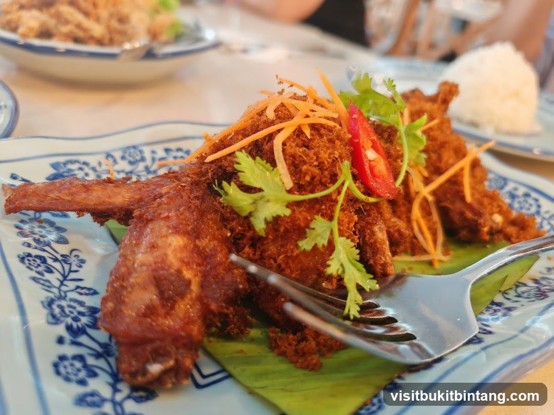 Fried Chicken Wings with Shredded Carrots and Cilantro
