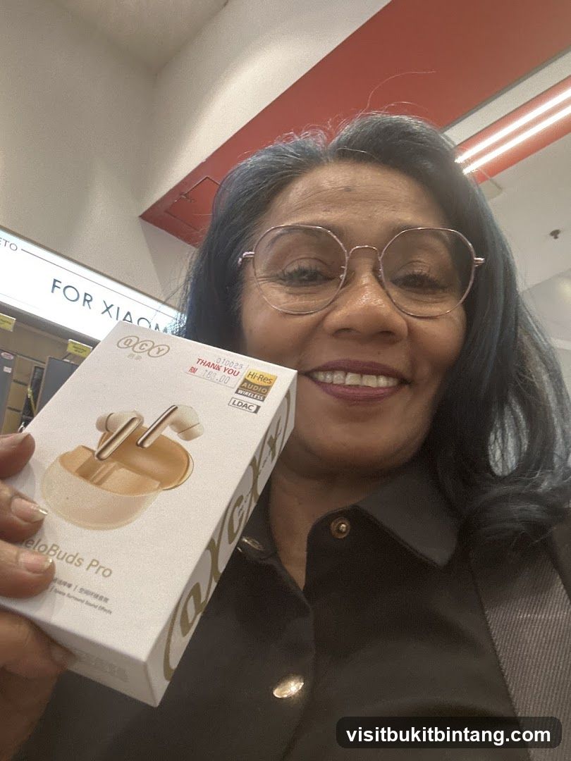Woman holding a box of earbuds