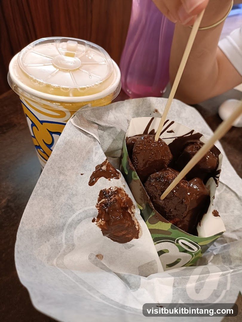Chocolate-covered donut holes and a drink