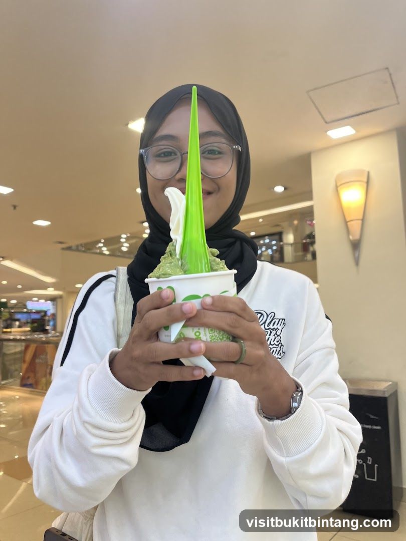 Woman holding a cup of soft serve ice cream
