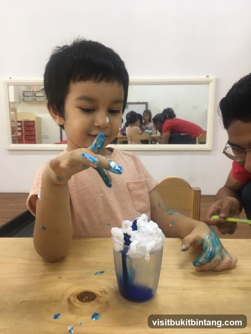 Child painting with shaving cream