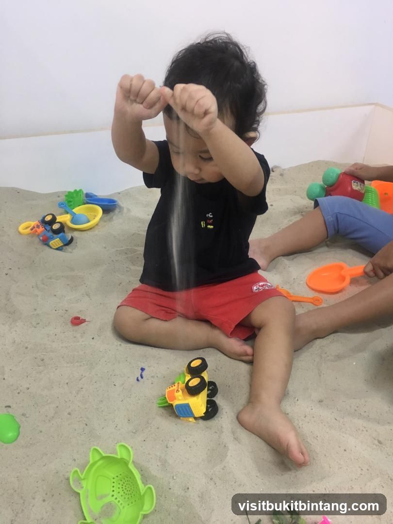 Child playing in a sandbox