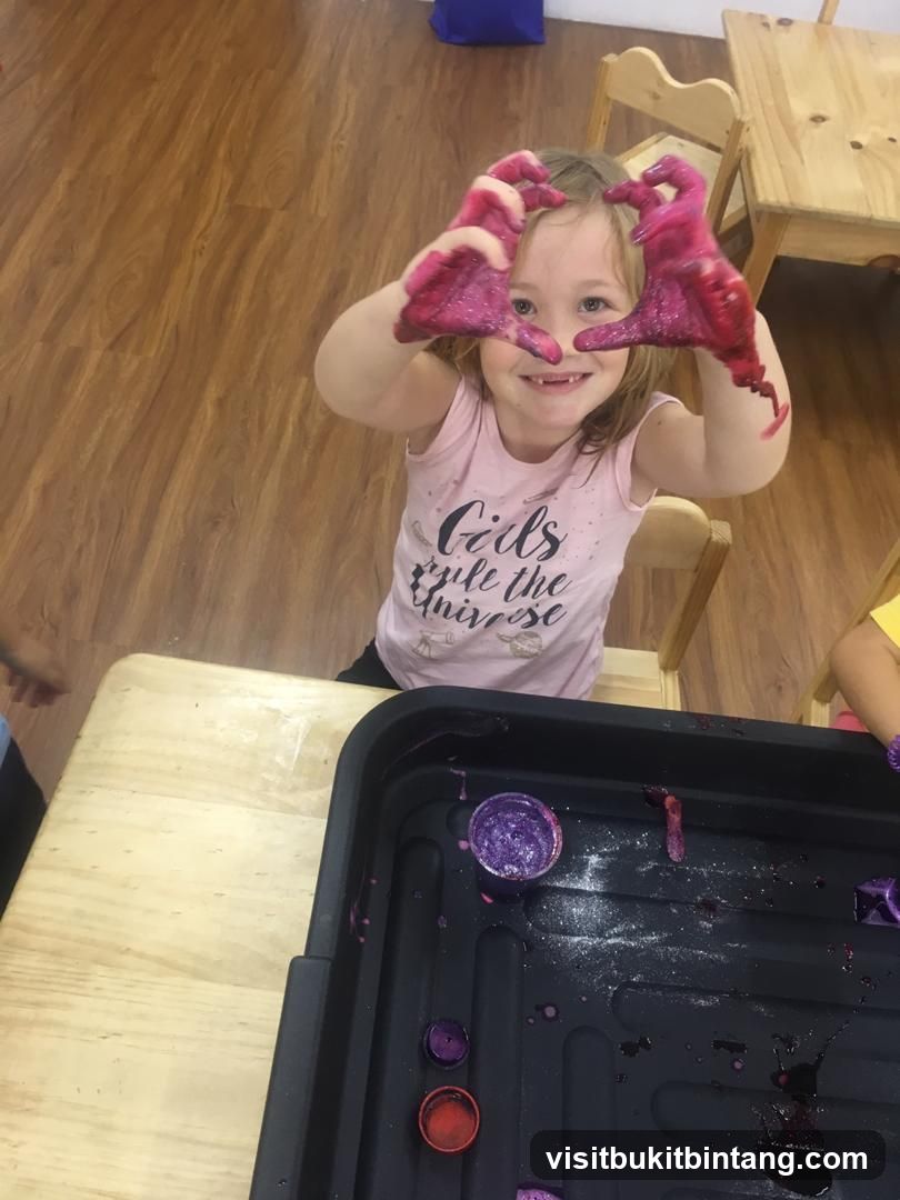 Child with glittery hands