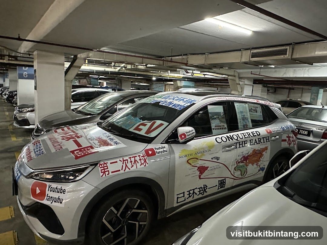 Car decorated with world map and YouTube channel stickers