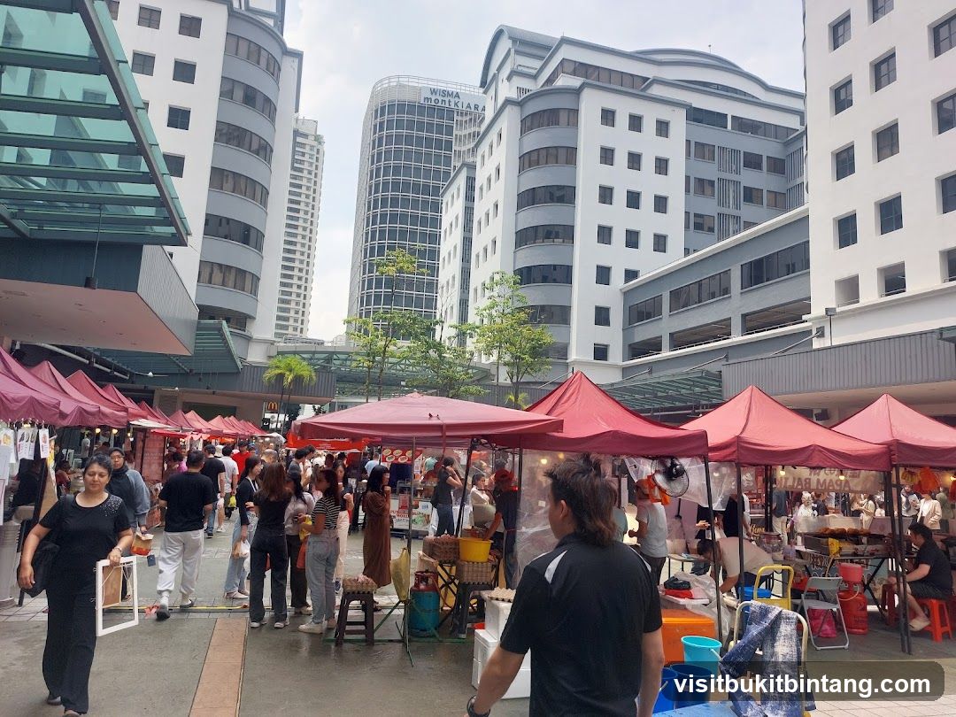 Outdoor Market with Tents and Tall Buildings