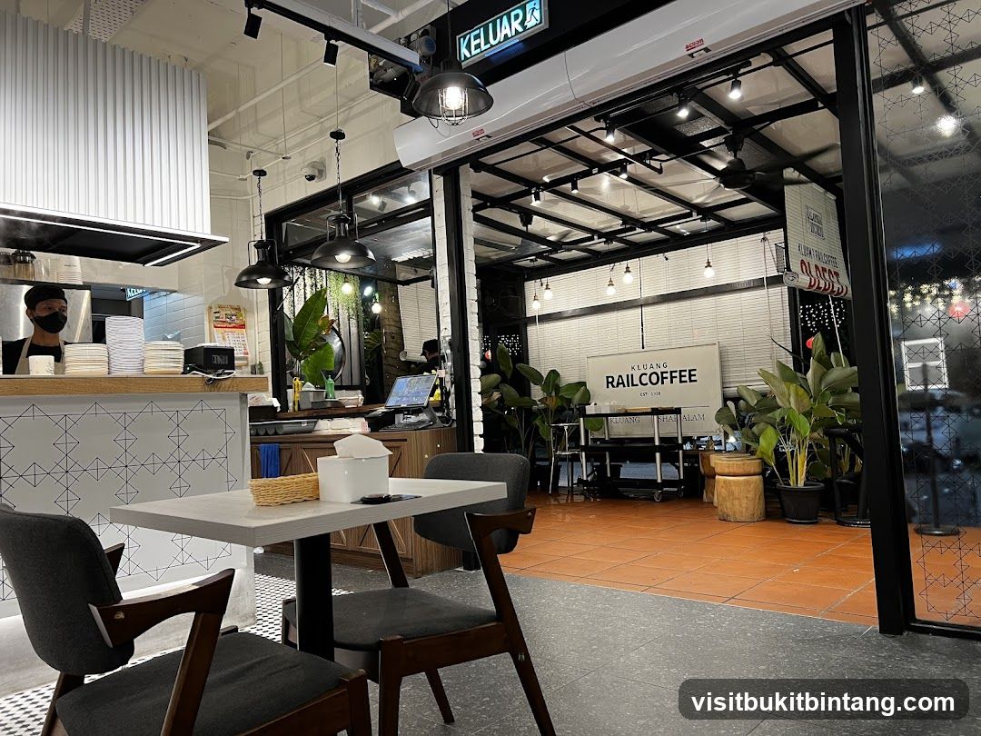 Interior of a cafe with seating and kitchen area