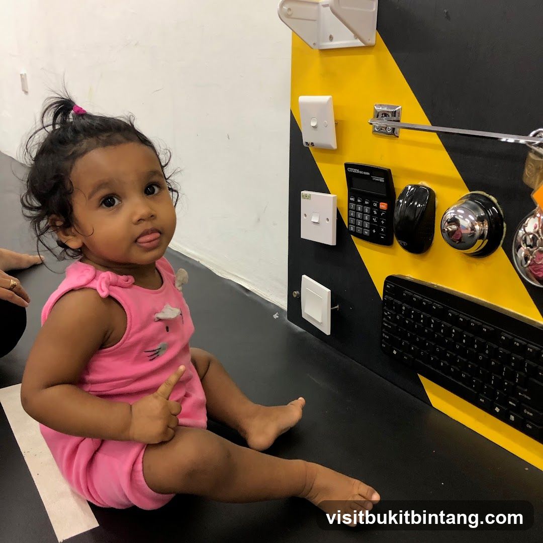 Toddler playing with a sensory board