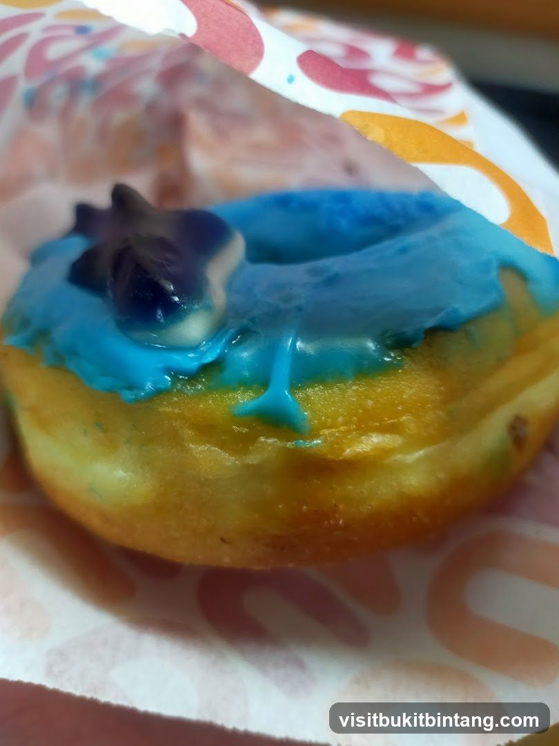 Blue Iced Donut with Gummy Topping