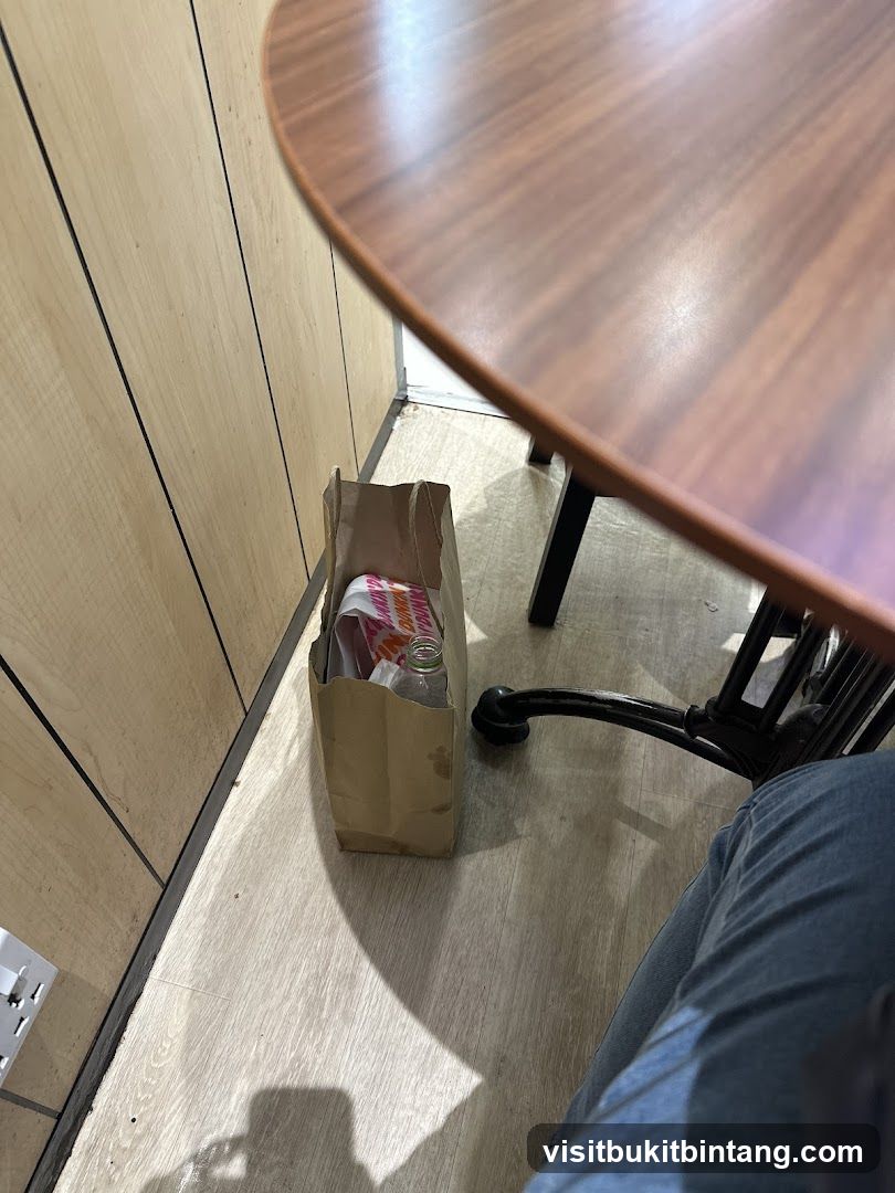 Dunkin' Bag and Bottle Under Table