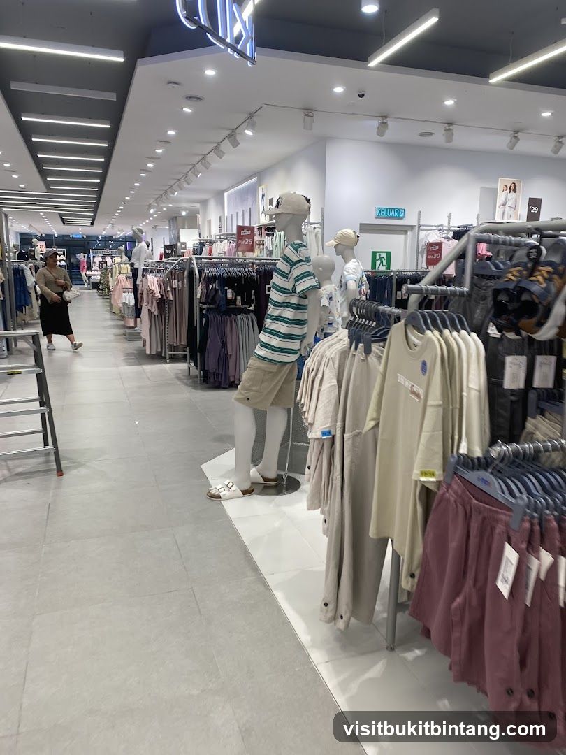Clothing store interior with mannequins and apparel