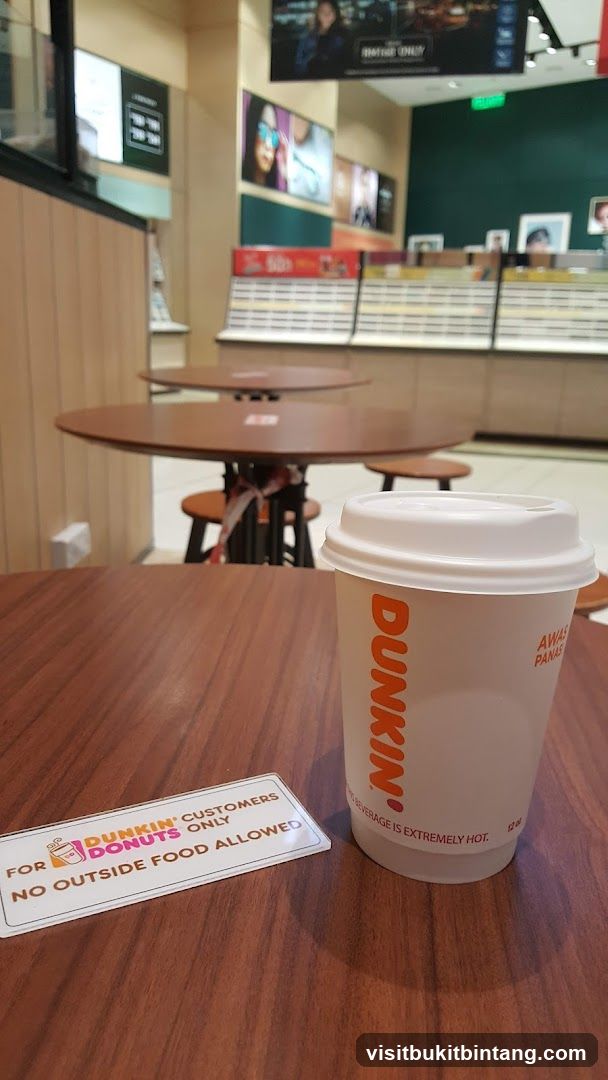 Dunkin' Coffee Cup and Sign