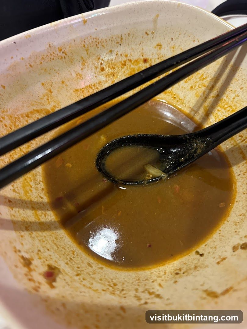Empty Bowl with Soup and Utensils