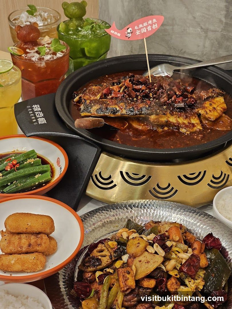 Spicy Fish Dish with Drinks and Sides