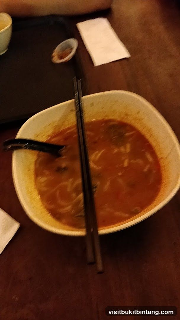 Bowl of Soup with Chopsticks