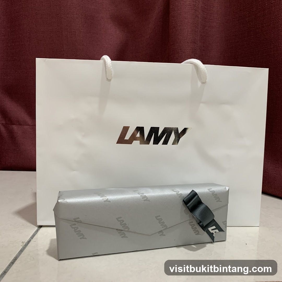 LAMY branded shopping bag and gift-wrapped item