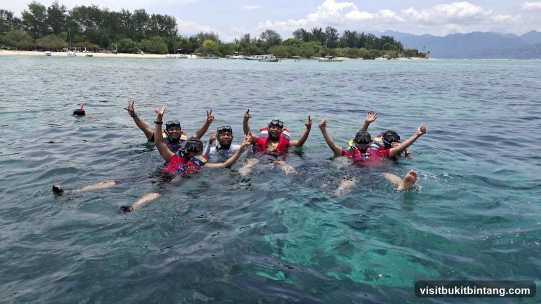 Group snorkeling in clear blue water