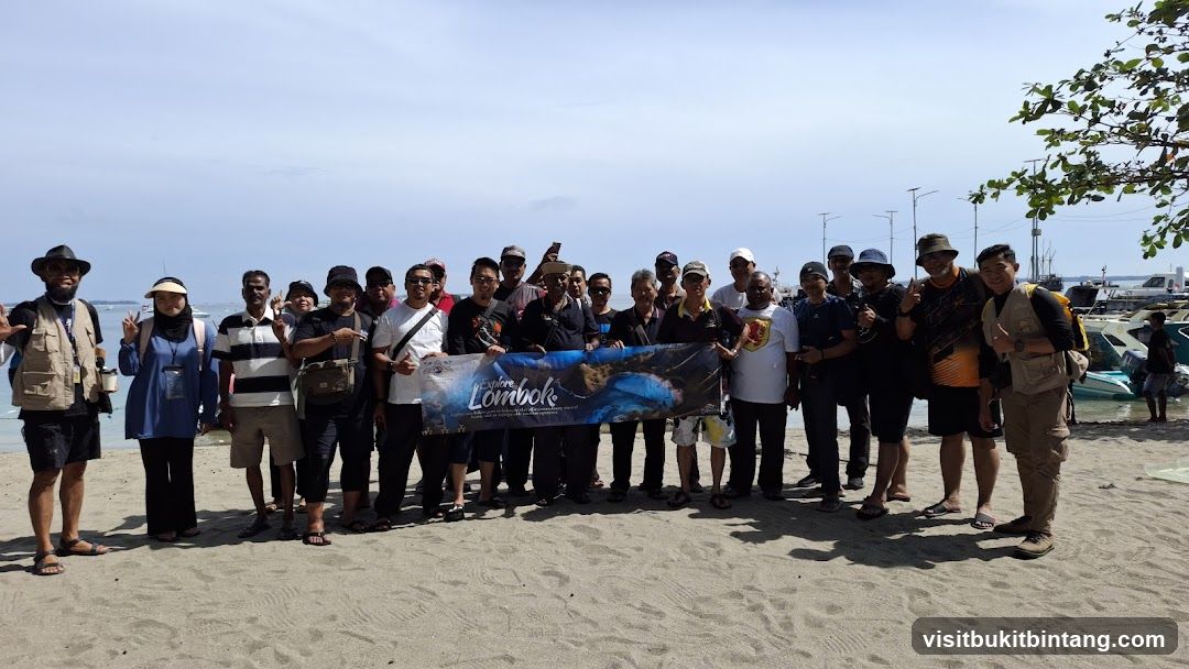 Group posing with a banner