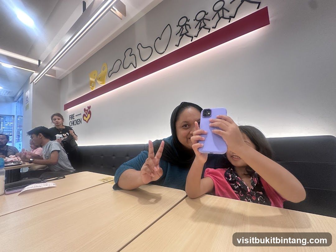 People taking a selfie in a restaurant