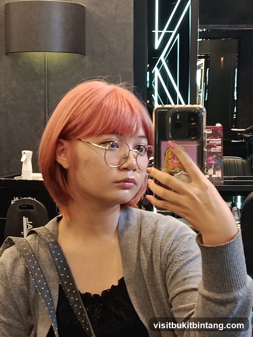 Woman taking a selfie in a salon