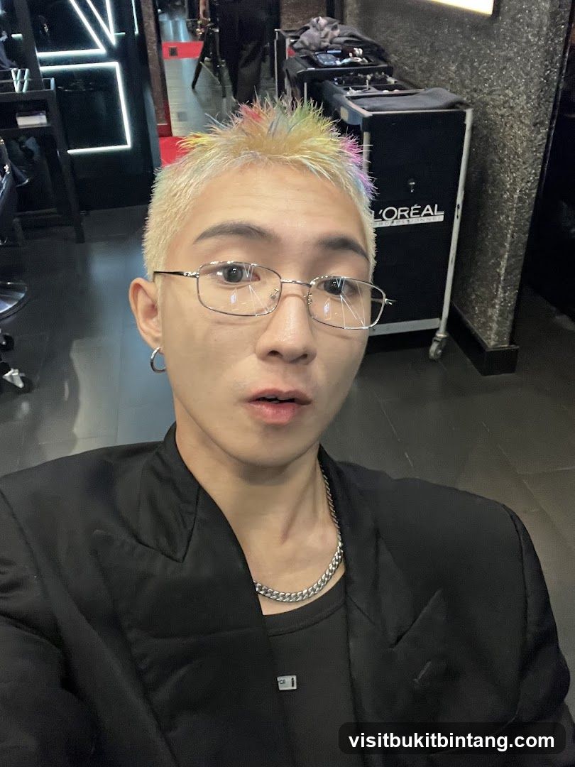 Man with colorful hair in a salon