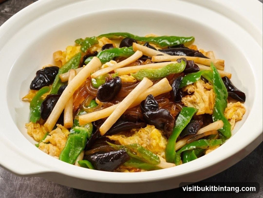 Stir-fried dish with noodles, vegetables, and mushrooms