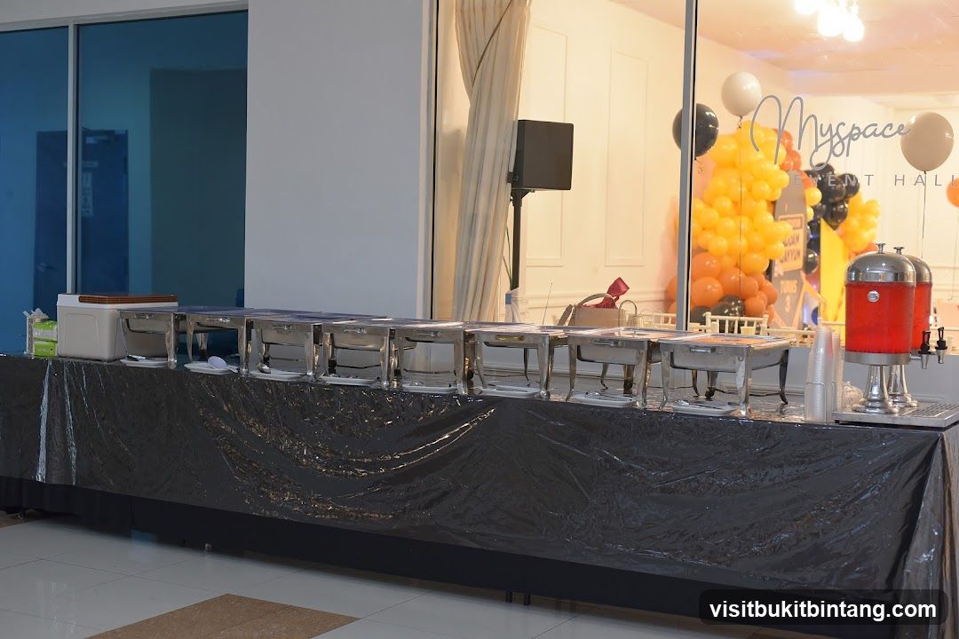Buffet Setup with Chafing Dishes and Drink Dispensers