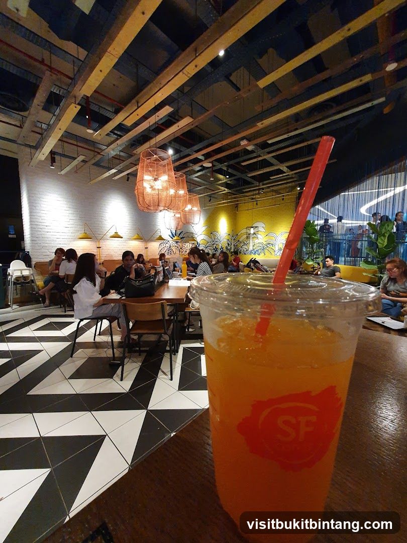 Interior of a cafe with a drink in the foreground