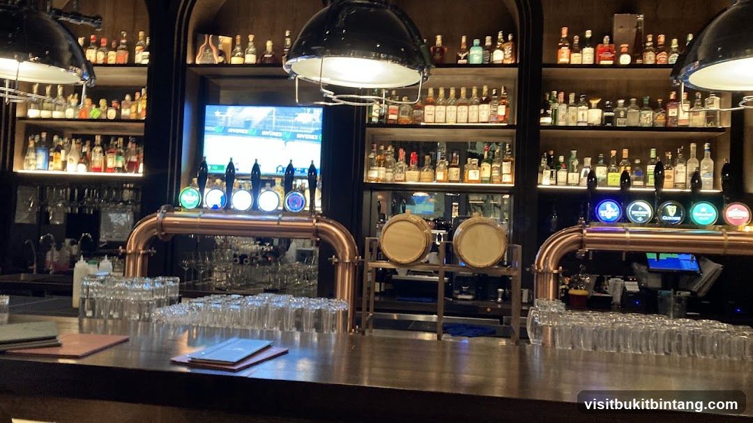 Bar Interior with Beer Taps and Shelves of Alcohol