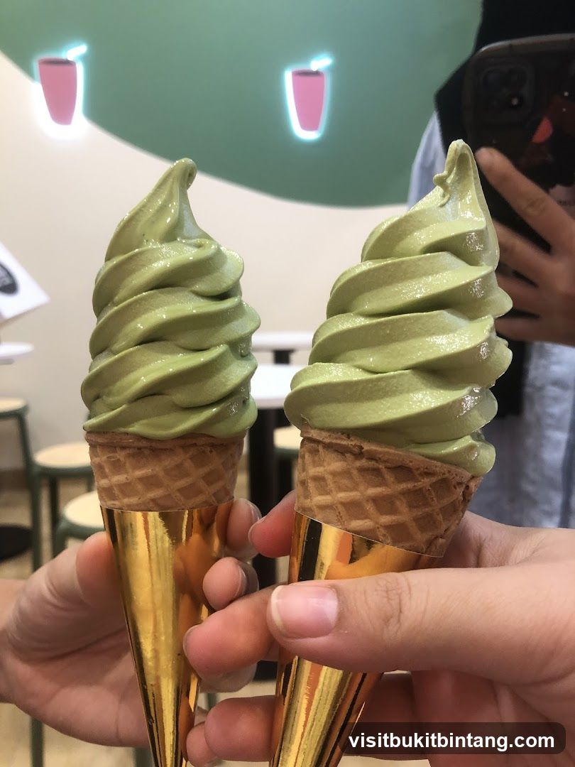 Two Green Soft Serve Ice Cream Cones