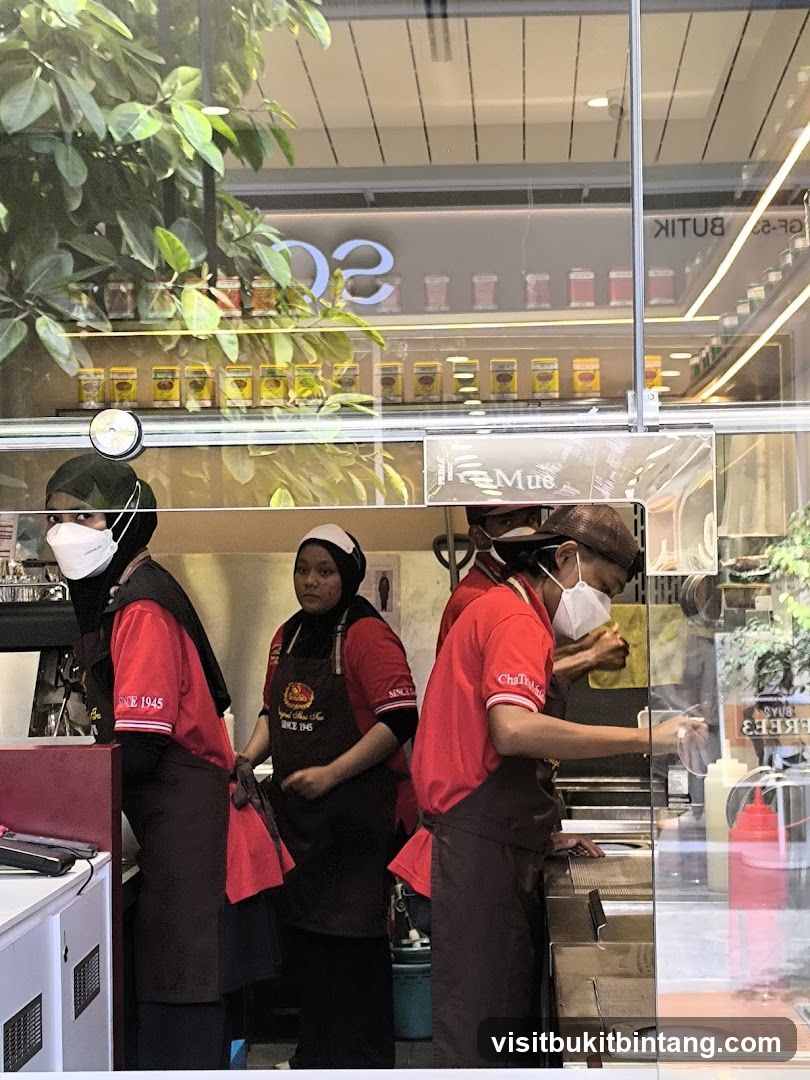 Staff preparing food behind a counter