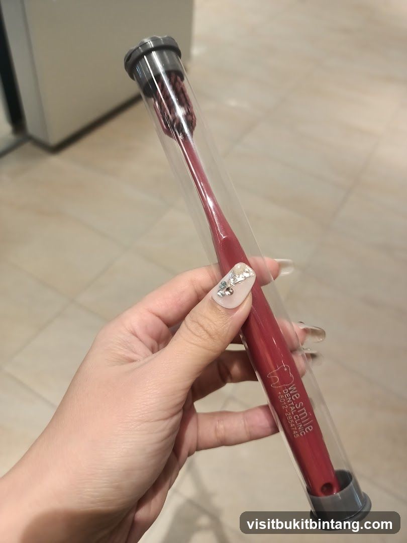 Red toothbrush in protective case