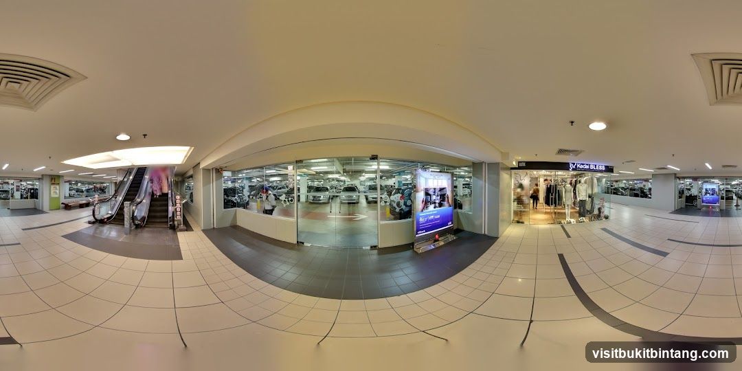 Shopping Mall Interior with Escalators and Shops