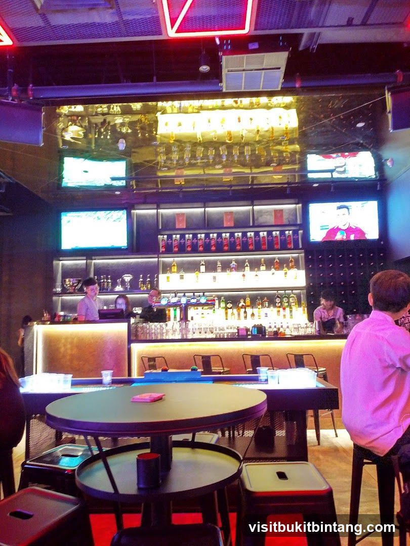 Bar Interior with Televisions and Bottles